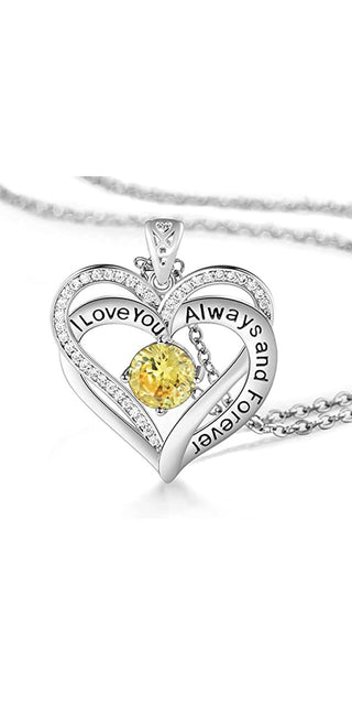 Elegant heart-shaped pendant necklace with sparkling crystal detail and vibrant yellow center stone, showcasing a timeless message of everlasting love.