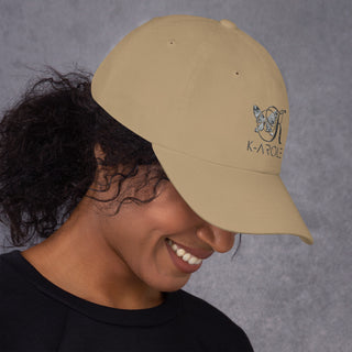 Stylish K-AROLE branded beige dad hat with curly hair visible on model