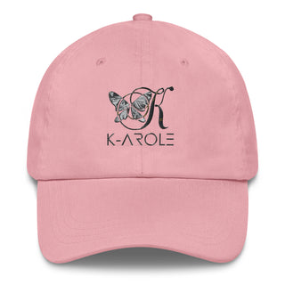Stylish pink dad hat with the K-AROLE brand logo featuring a butterfly graphic design. The hat is displayed on a plain background, showcasing its casual and trendy appearance.