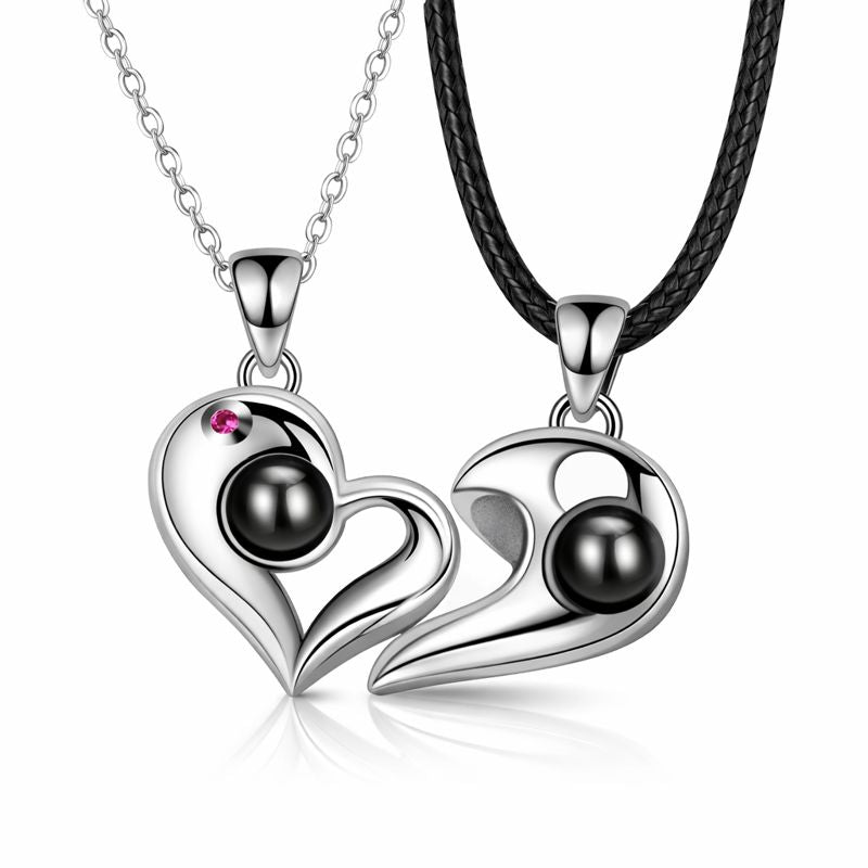 925 silver heart projection couple necklace with intertwined pendants, minimalist jewelry photography on neutral background