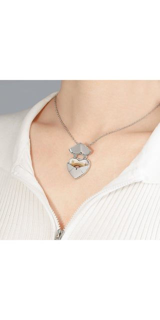 Elegant heart-shaped pendant necklace with cloud design on a metal chain, showcased against a plain white background.
