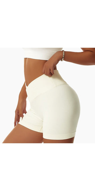 Tight, seamless white shorts for active women showcasing a toned, athletic figure.