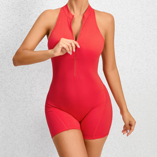 Red sleeveless sports jumpsuit with zipper accent and tummy control feature, designed for yoga, fitness, and activewear.
