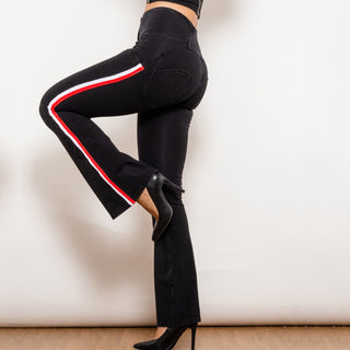 Stylish women's high-waist black jeggings with bold red and white striped accents, showcasing a sleek, form-fitting silhouette.