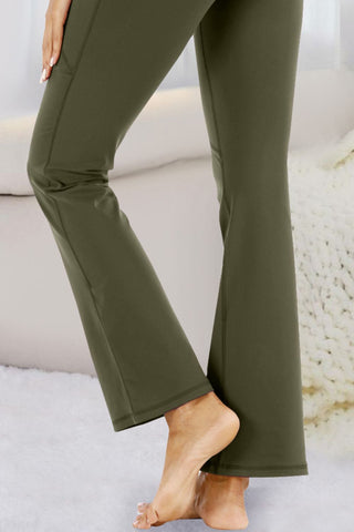 Stylish olive green flared yoga pants with a sleek, comfortable design.