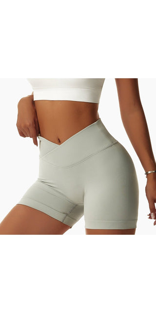 Form-fitting white workout shorts for women with a sleek, high-waisted design.