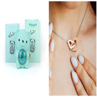 Rotating Eternal Flower Ring Necklace Gift Box - Elegant jewelry item with a heart-shaped pendant and necklace, displayed in a mint-colored gift box.
