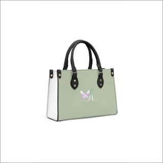 Trendy mint green women's handbag with black accents and a distinctive logo on the front. The stylish tote bag features a structured silhouette and dual top handles, showcasing a modern and sophisticated design.