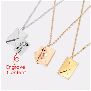 Delicate metal envelope-shaped pendant necklaces in silver, rose gold, and gold tones. Stylish jewelry pieces featuring intricate designs and engraving for personalized expression.