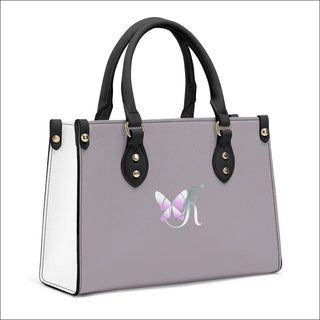 Luxury Women's PU Handbag with Butterfly Logo
This stylish and versatile handbag features a sleek gray and white design with a butterfly logo, providing a modern and fashionable accessory for women.