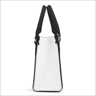 Elegant white and black PU leather tote bag with double handles and zipper closure, perfect for stylish women on the go.