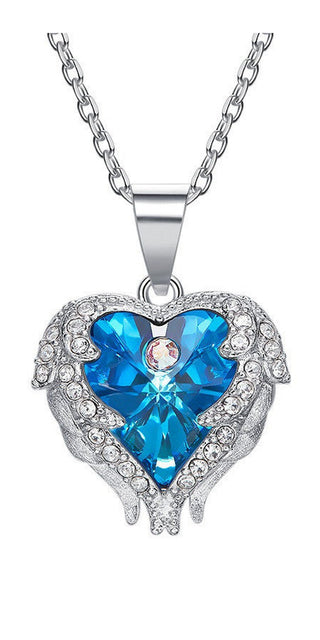 Elegant Crystal Heart Necklace: Shimmering silver-tone chain showcases an ornate heart-shaped pendant adorned with dazzling blue and clear crystals. A captivating accessory to elevate any K-AROLE athleisure outfit.