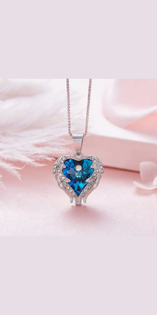 Radiant crystal heart necklace with angel wings design, elegant women's fashion accessory.