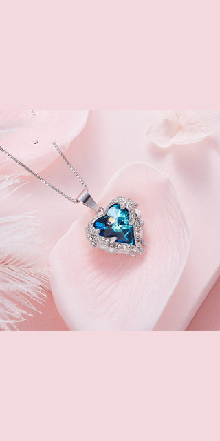 Elegant Heart-Shaped Necklace with Sparkling Gems on Soft Fabric Background