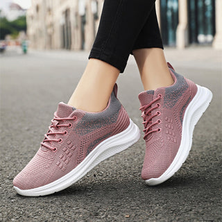 Comfortable and stylish pink knit sneakers for women, featuring a breathable and lightweight design with a lace-up closure for a secure fit.