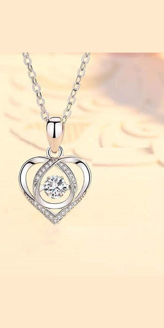 Elegant heart-shaped sterling silver necklace with sparkling cubic zirconia stone, a timeless jewelry piece.