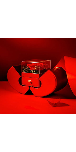 Striking red geometric jewelry box with sparkling accents, showcasing fashionable accessories against a dramatic crimson backdrop.