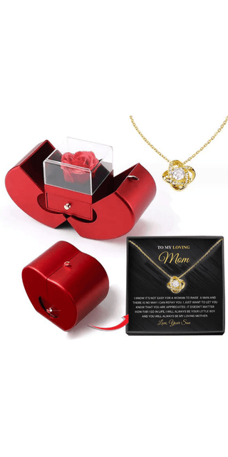 Elegant gold necklace with flower charm in a stylish red gift box. Exquisite jewelry for special moments.