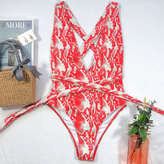 Vintage-Inspired One-Piece Swimsuit - Classic Red and White Pattern - Placed on a Table