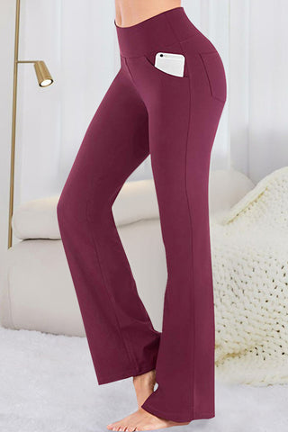 Burgundy flared yoga pants with side pocket displayed against a white background