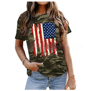 Stylish camouflage-patterned women's t-shirt with vibrant American flag graphic design, casual and trendy summer fashion apparel.