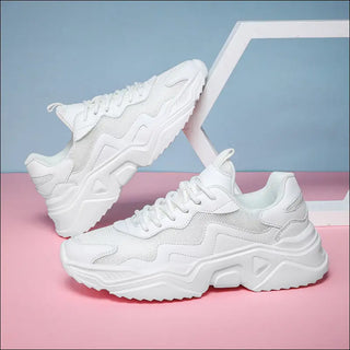 Sleek and stylish white sneakers with a chunky sole design, showcasing a modern and trendy look. These Hypersku NetFit Boost Sneakers feature a comfortable and supportive construction, perfect for elevating your casual style.