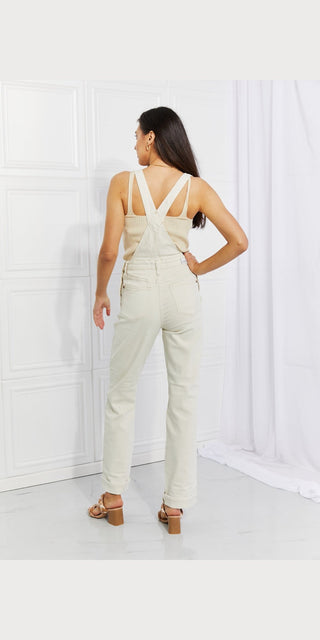 Fashionable women's overalls with criss-cross back straps, showcased against a plain white background.