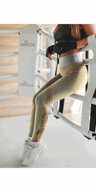 Stylish women's leggings with unique designs and monument pockets, displayed on a fitness equipment in a modern home gym setting.