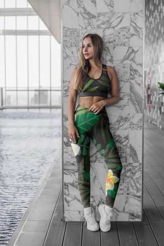Vibrant floral-patterned sports leggings and coordinating sports bra, stylish athletic attire for a sporty workout session.