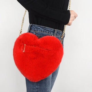 Vibrant Red Heart-Shaped Plush Shoulder Bag - Stylish crossbody accessory featuring a soft, furry red heart-shaped design and a detachable chain strap for versatile wear.