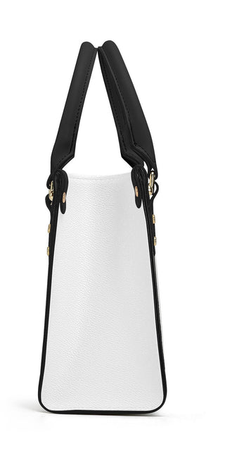 Elegant leather tote bag by K-AROLE - stylish white and black design, perfect for women's athleisure outfits.