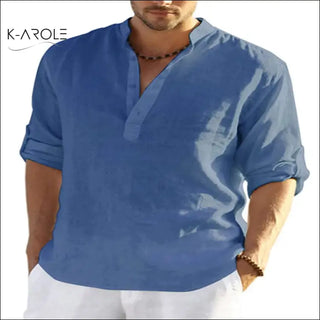 Smart casual look with a men's blue linen shirt from K-AROLE. The shirt features a stand collar and loose, relaxed fit, making it a comfortable and stylish choice for everyday wear.