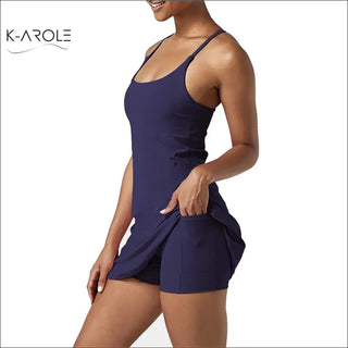Navy blue athletic dress with pockets and a fitted silhouette, perfect for tennis, yoga, or running.