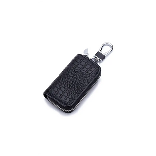 Sleek black leather key holder with zip closure and clip, perfect for organized storage of car keys, wallet and other small essentials.