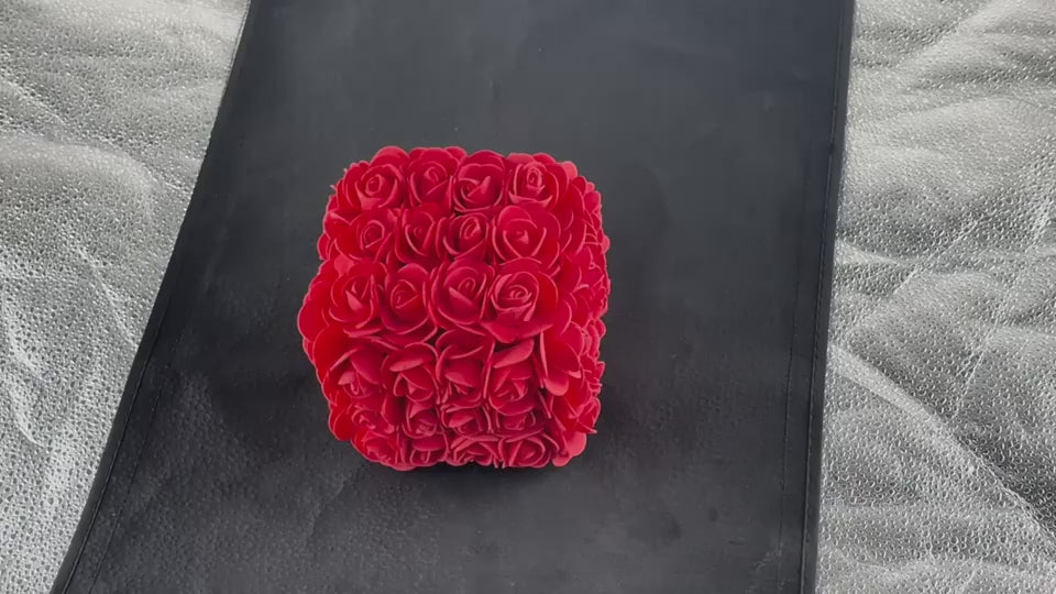 Captivating rose-shaped jewelry gift box on sleek black surface
