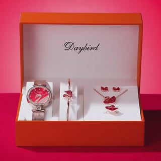 Stylish women's jewelry set with red heart-shaped accessories and a watch displayed in a red gift box from K-AROLE's Valentine's Day collection.