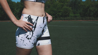 Stylish athletic shorts with abstract print design, perfect for active outdoor wear. High-quality sports apparel from K-AROLE featuring trendy graphics and comfortable fit.