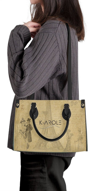 Elegant K-AROLE™ designer tote bag with metallic accents, showcasing a stylish and practical accessory for the modern woman.