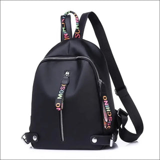 Fashionable black backpack with colorful logo straps, featuring multiple zippers and pockets for convenient storage. This versatile bag is perfect for everyday use or travel, showcasing a sleek and modern design.