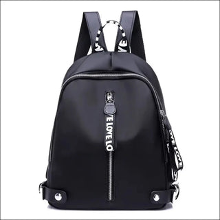 Stylish black backpack with bold text and zipper details, perfect for fashionable urban adventures.