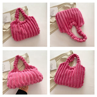 Vibrant pink plush tote bag with textured and pom-pom accents, showcasing a stylish and cozy winter accessory.
