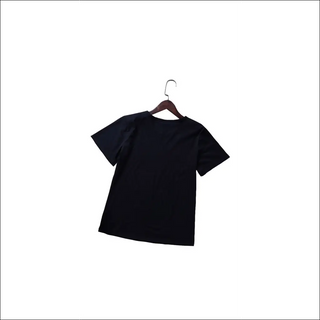 Stylish black women's t-shirt with a simple design, displayed on a wooden hanger against a clean white background.