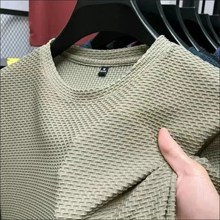 Textured khaki pullover sweater for men on clothing rack in retail store