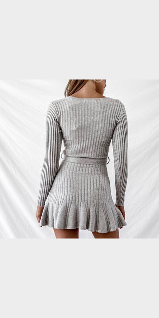 Premium loose knit dress in chic gray color with ribbed design and flared hem.