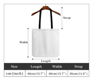 Stylish white cotton tote bag with wooden hanger, featuring adjustable strap for versatile carrying.