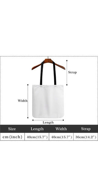 Stylish women's white cotton tote bag with adjustable strap and wooden hanger, showcasing versatile and trendy fashion accessory.