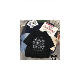 Casual black t-shirt with save the bees graphic design, books, and sneakers displayed on a table