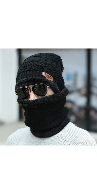 Stylish winter headgear: Warm black knit hat and matching balaclava mask with sunglasses for cold weather fashion and protection.