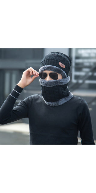 Chic knitted winter hat and face mask in black, worn by a person to stay warm and stylish during the cold season.