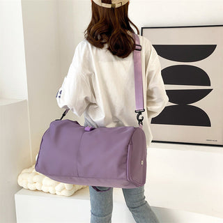 Stylish women's sports bag in lavender, designed for yoga or fitness with dry and wet compartments for convenient storage while traveling.